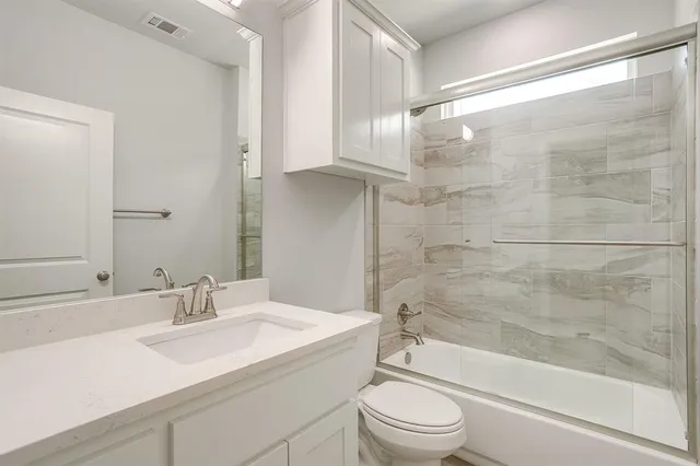 a bathroom with a sink a toilet and a bathtub