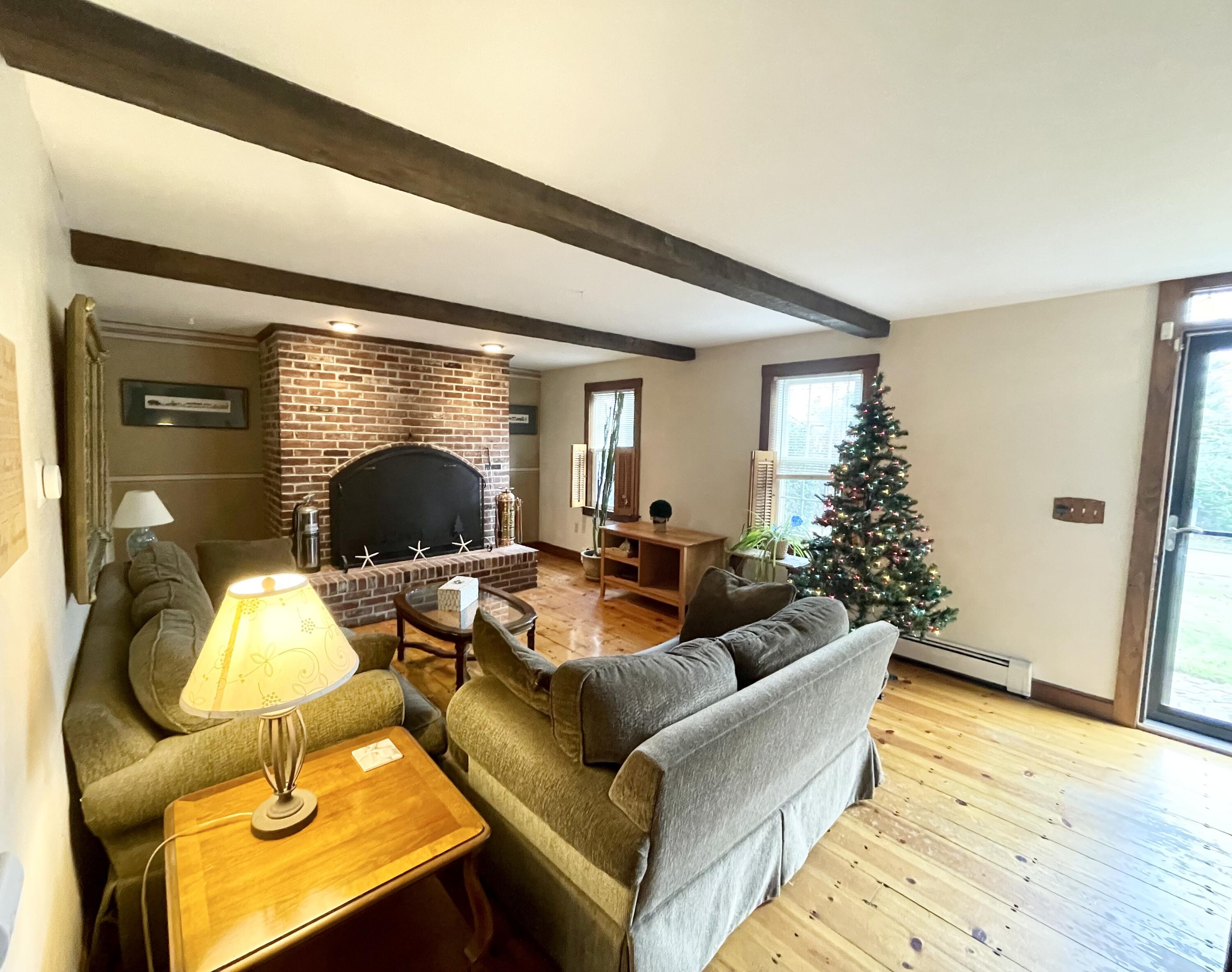 89 Sheaffer Road Centerville, MA 02632 - Photo 15 of 58 Living room Fireplace.soft pine flooring
