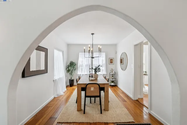 a view of a livingroom with furniture window and wooden floor