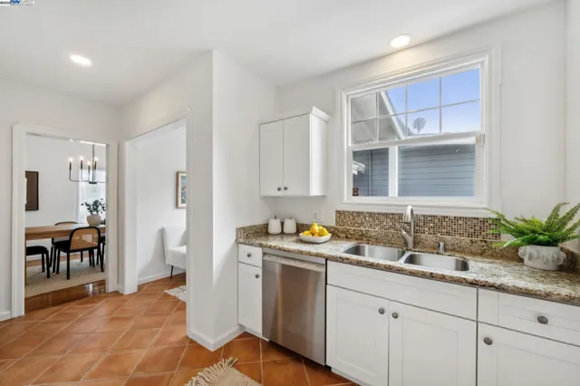 a room with a sink and cabinets