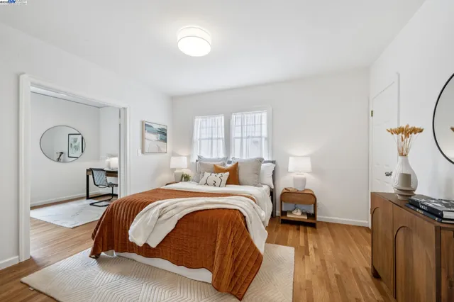 a bedroom with a bed and a table