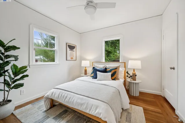 a bedroom with bed and a window