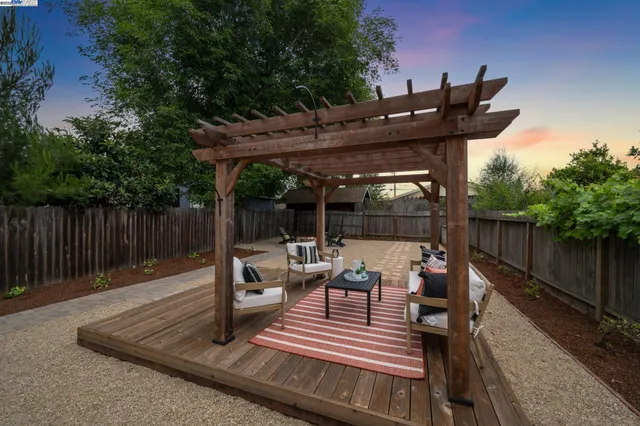 a view of outdoor sitting area with furniture
