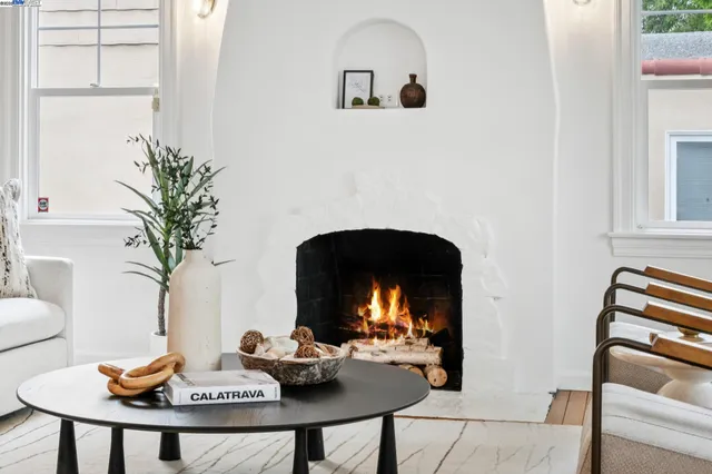 a living room with furniture a table and chair
