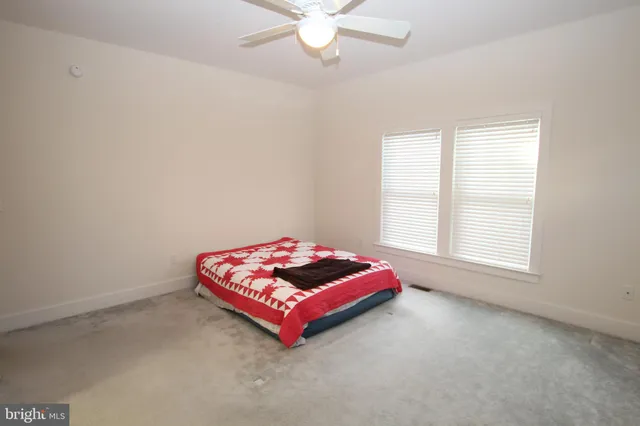 a room with pool table and window