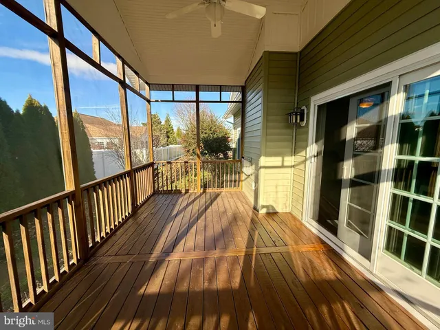 a view of balcony with wooden floor