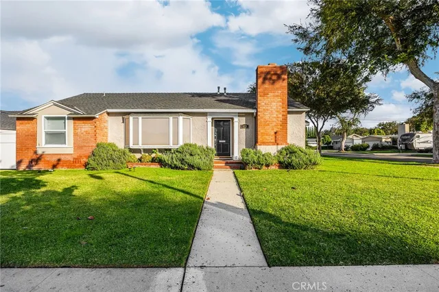a front view of a house with yard