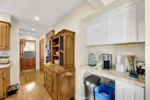 a kitchen with stainless steel appliances granite countertop a sink and cabinets