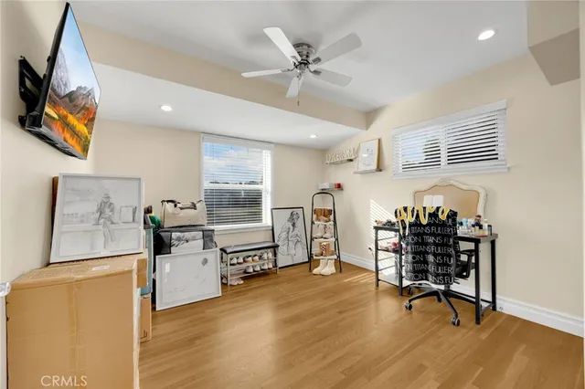 a view of a workspace with furniture and a living room