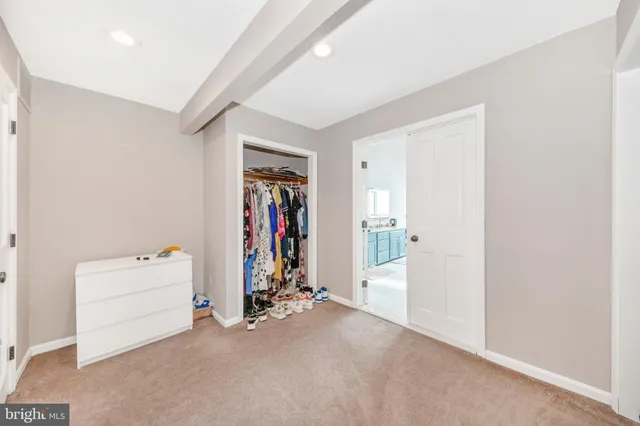 a bedroom with furniture and window