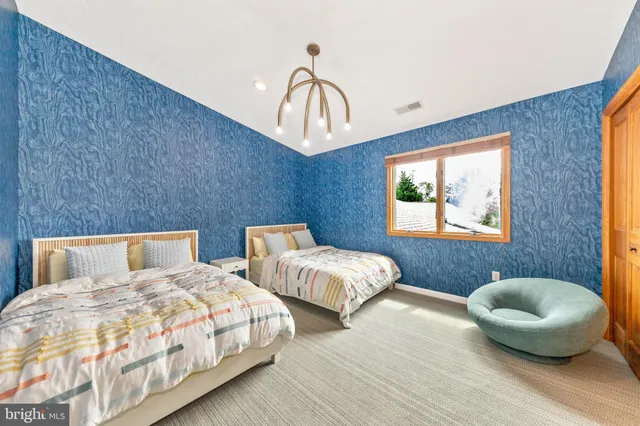 a bed room with a bed and a window