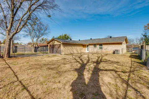 a view of road with large trees