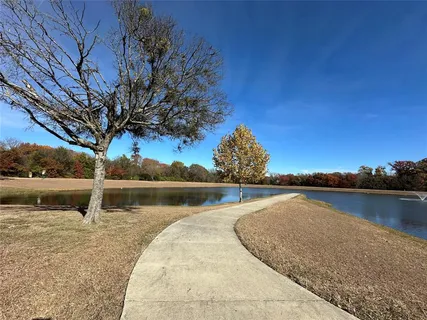 a view of a playground with basketball court