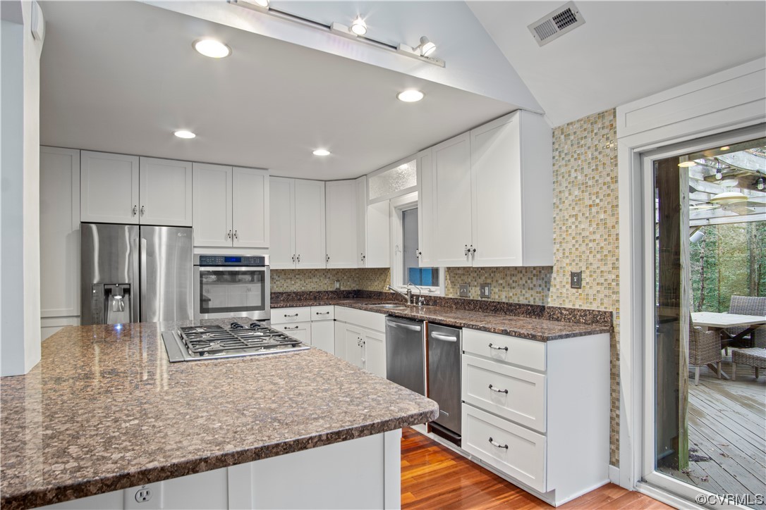 103 Overlook Drive Williamsburg, VA 23185 - Photo 18 of 50 a kitchen with stainless steel appliances granite countertop a sink stove and refrigerator