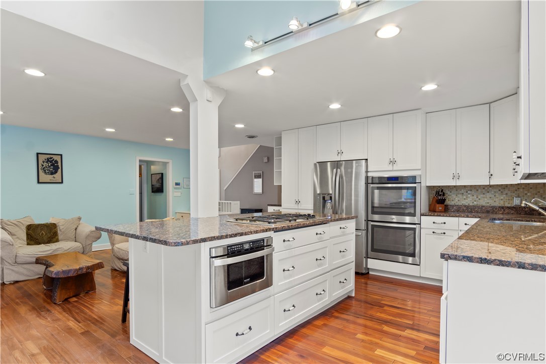 103 Overlook Drive Williamsburg, VA 23185 - Photo 2 of 50 a kitchen with stainless steel appliances kitchen island granite countertop a stove and a refrigerator