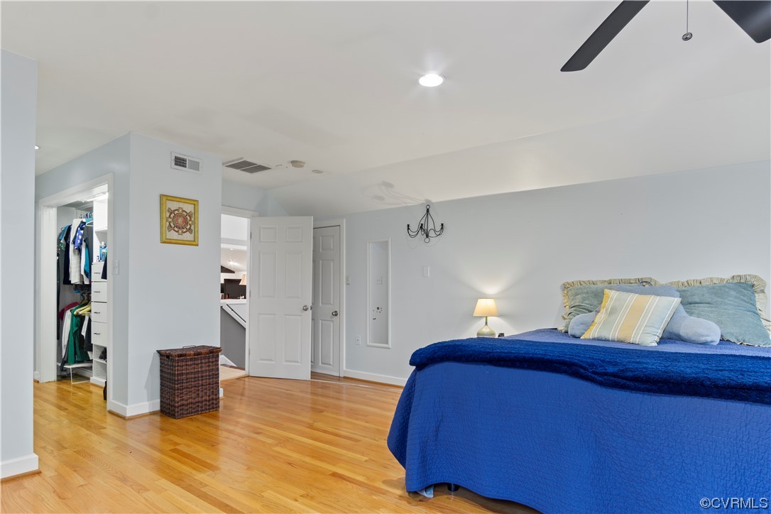 103 Overlook Drive Williamsburg, VA 23185 - Photo 33 of 50 a bedroom with a bed and wooden floor