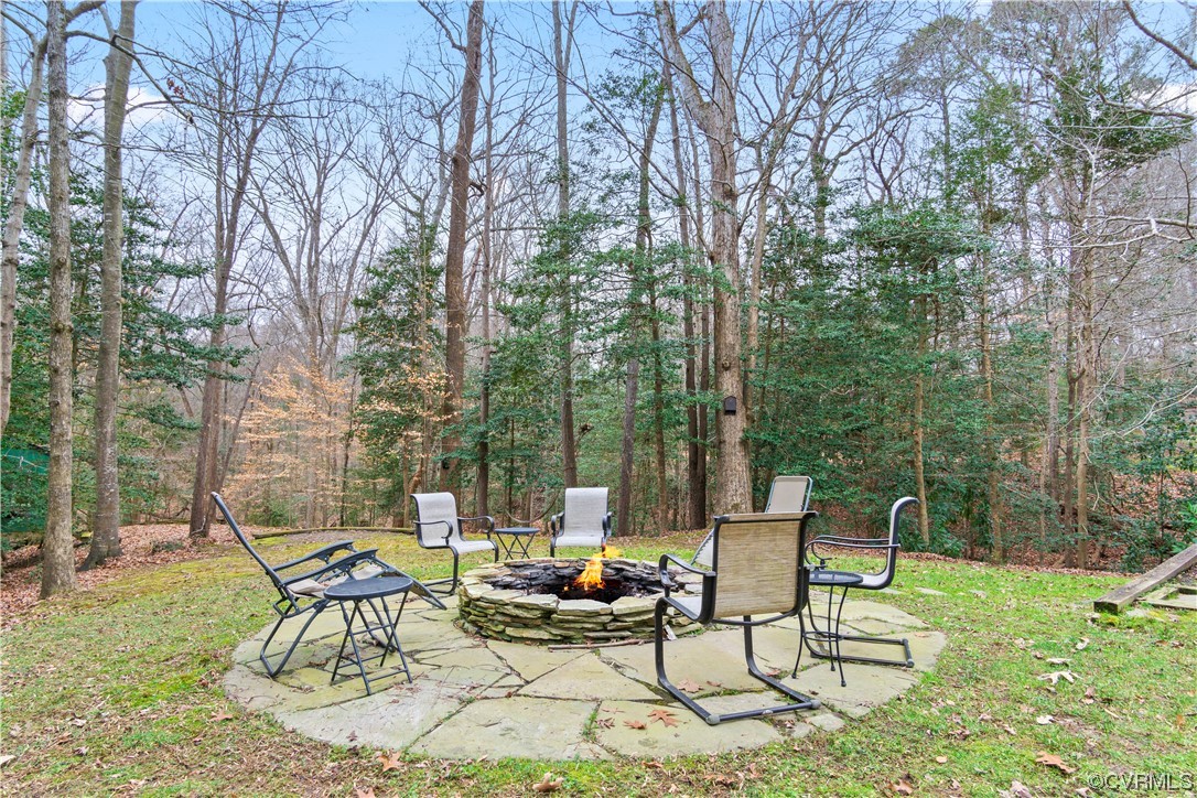 103 Overlook Drive Williamsburg, VA 23185 - Photo 45 of 50 a view of a chairs and table in backyard of the house