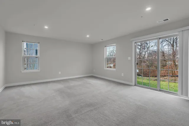 a view of an empty room with windows