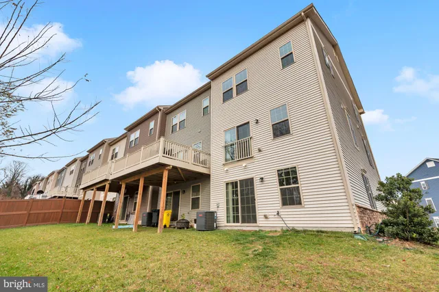 a view of white house with a yard