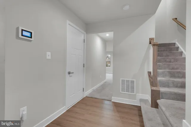 a view of entryway with wooden floor