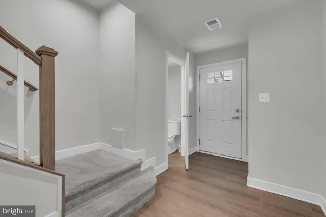 a spacious bathroom with a sink and a mirror