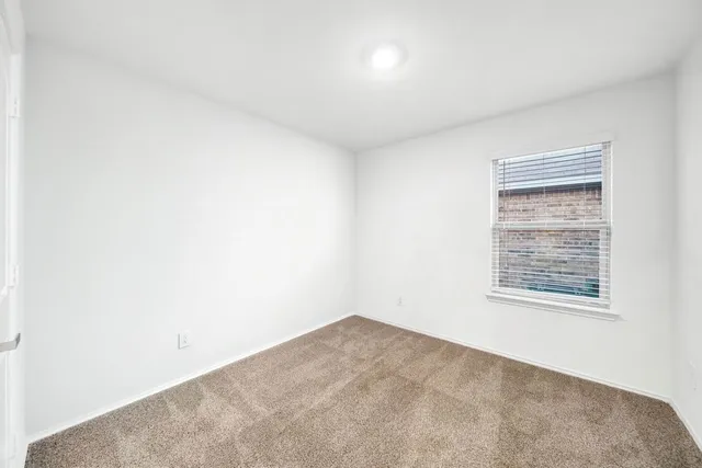 a bathroom with a toilet and a sink