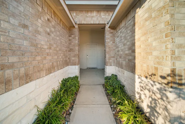 a kitchen with stainless steel appliances kitchen island a sink and a refrigerator
