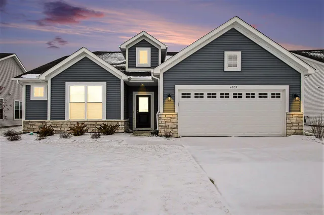 a view of a house with large windows