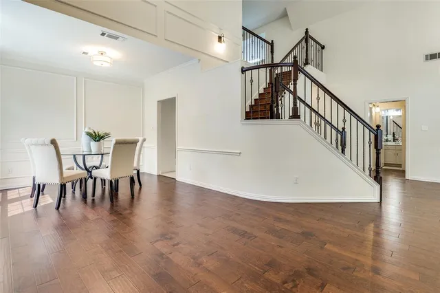 a view of dining room with furniture and wooden floor