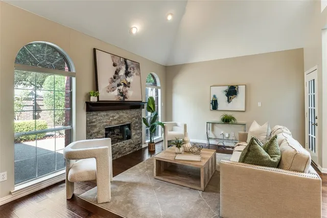 a living room with furniture and a fireplace