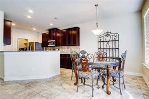 2723 Intrepid Trail Rosenberg, TX 77471 - Photo 11 of 30 Between the family room and kitchen is a light filled breakfast area perfect for early morning meals or just sitting down to enjoy a cup of coffee before starting your day.