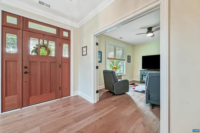 a bedroom with a bed and flat screen tv