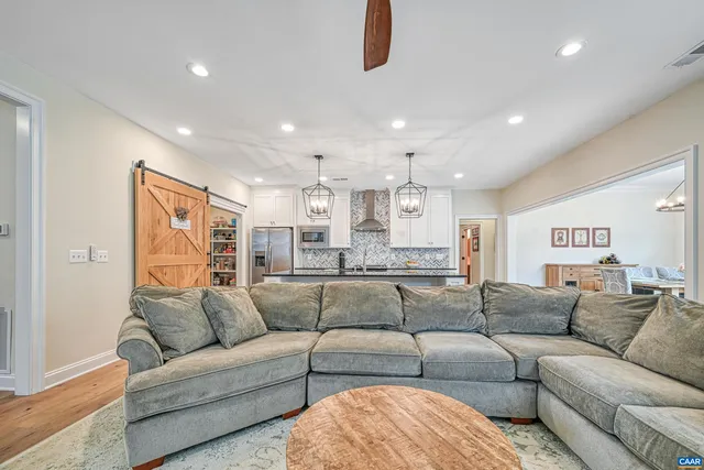 a kitchen with stainless steel appliances granite countertop a sink and cabinets