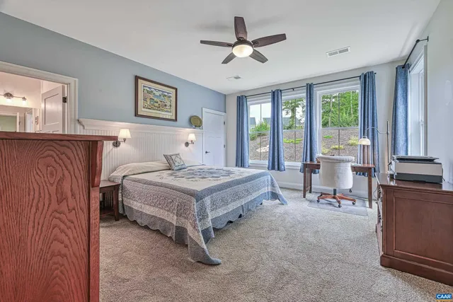 a spacious bathroom with a shower sink and a mirror