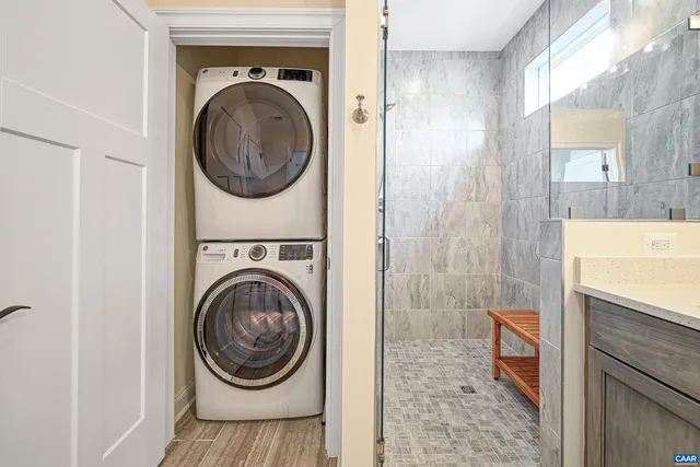a view of entryway with wooden floor and windows