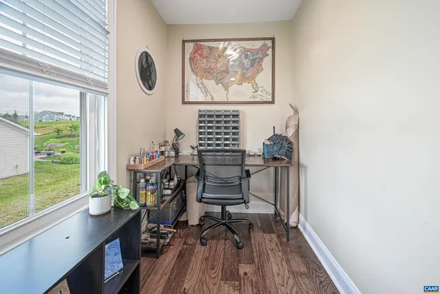 an aerial view of a house with garden space and street view
