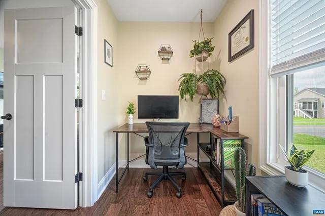 an aerial view of a house with swimming pool and outdoor space