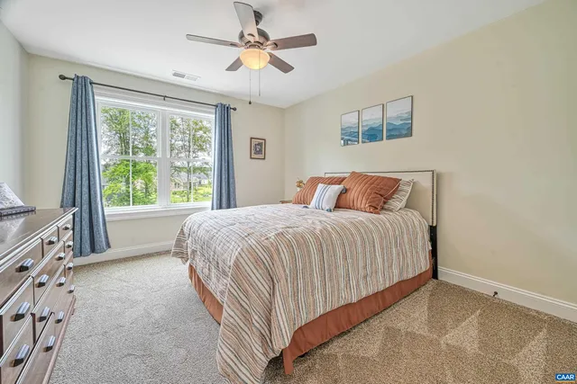 an aerial view of a residential houses with outdoor space and street view