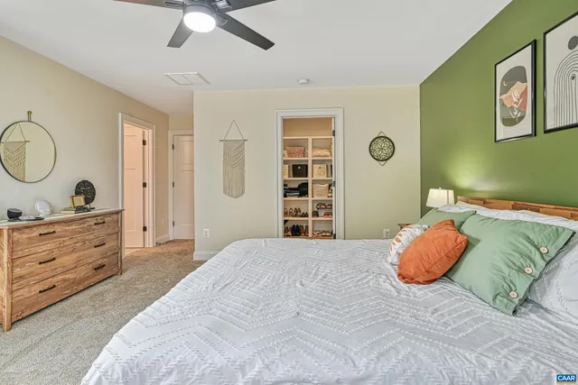 a bedroom with a bed and cabinets