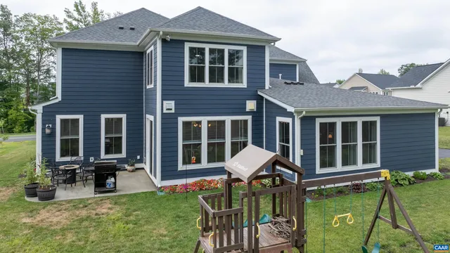 a view of a house with a chairs in patio