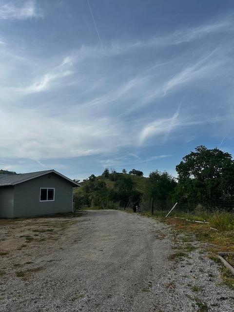 35312 George Smith Road Squaw Valley, CA 93675 - Photo 3 of 39 a view of house with green field