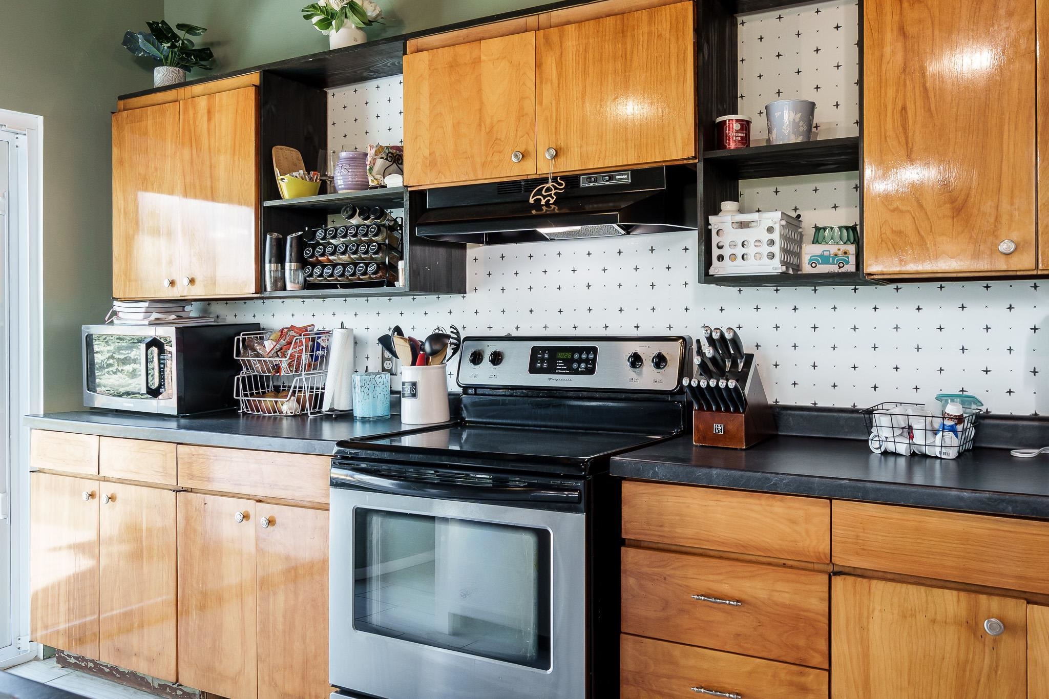 3021 North Dakota Road Freeport, IL 61032 - Photo 18 of 44 a kitchen with stainless steel appliances granite countertop a stove and a microwave