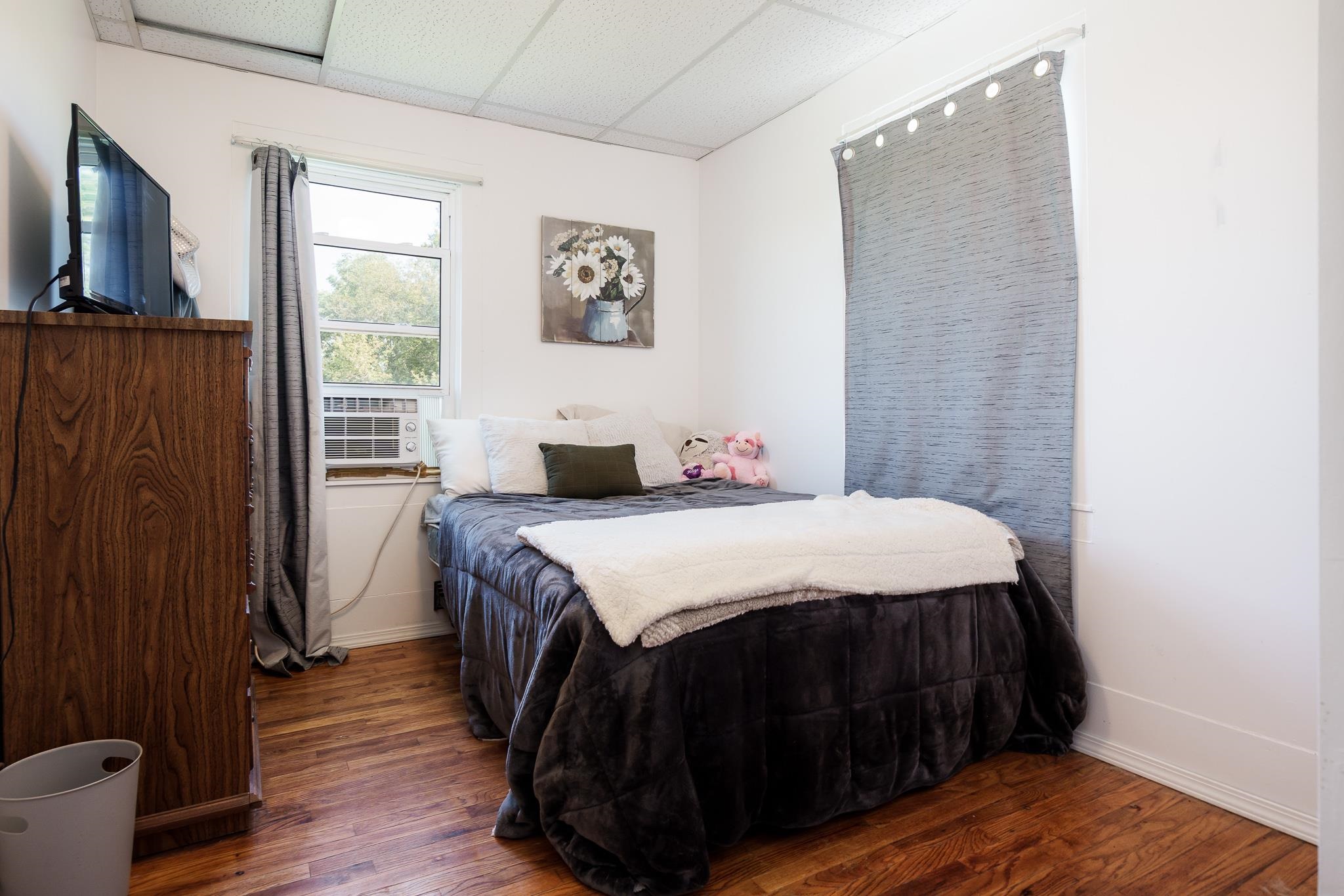 3021 North Dakota Road Freeport, IL 61032 - Photo 22 of 44 a bedroom with a bed and a flat screen tv