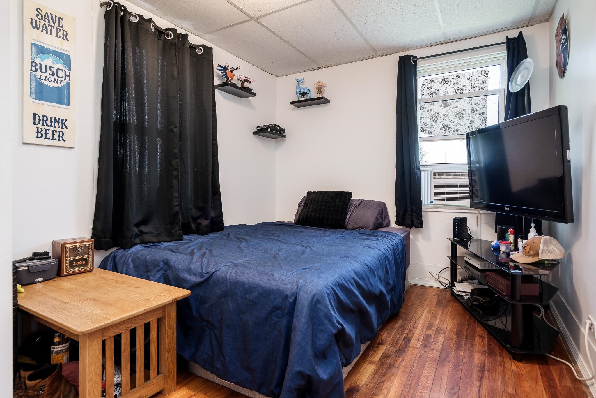 3021 North Dakota Road Freeport, IL 61032 - Photo 23 of 44 a bedroom with a bed and a flat screen tv