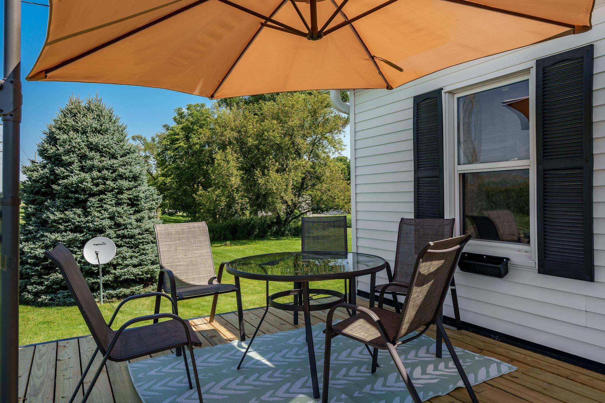 3021 North Dakota Road Freeport, IL 61032 - Photo 7 of 44 a view of patio with table and chairs and potted plants