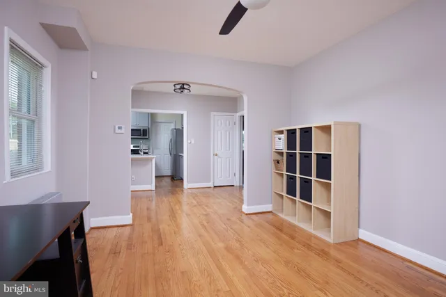 a view of wooden floor and windows in a room