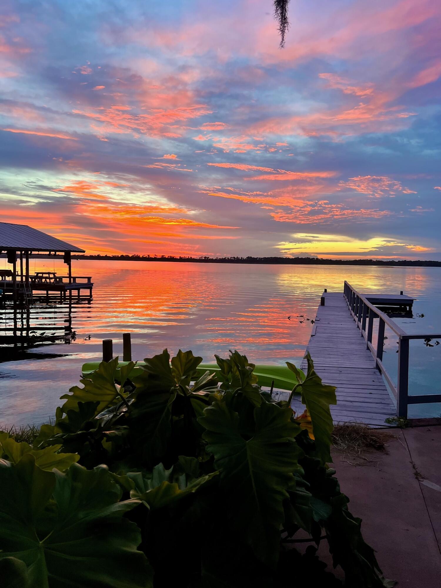 309 Oak Road Sebring, FL 33875 - Photo 1 of 39 Sunset over Loon Cottage Dock