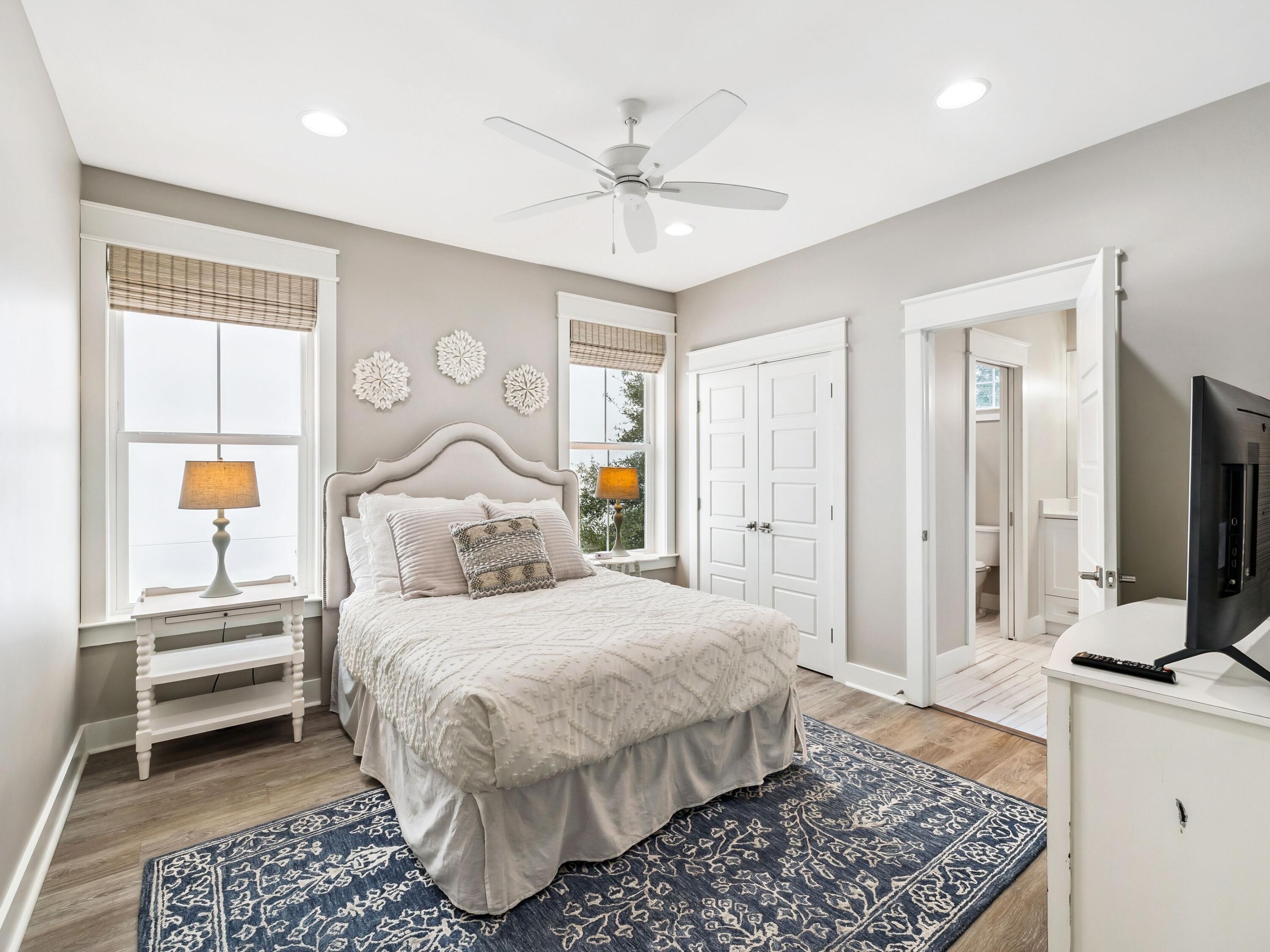 29 Tidewater Ct Inlet Beach Inlet Beach, FL 32461 - Photo 17 of 25 a bedroom with a bed and a flat screen tv