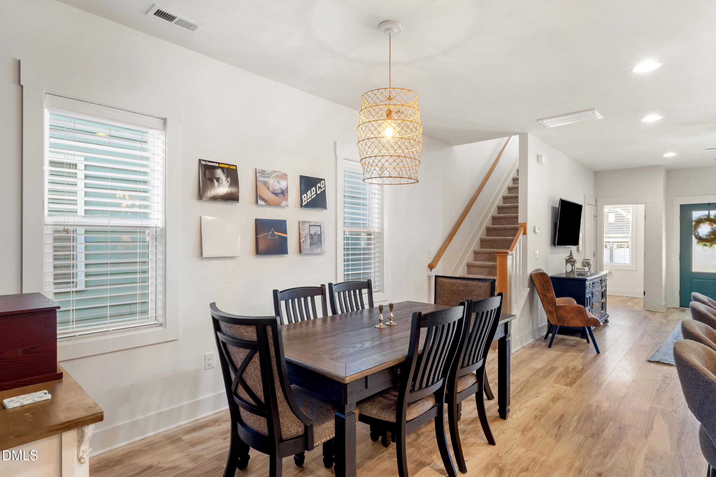 748 Groveview Wendell, NC 27591 - Photo 12 of 38 a view of a dining room with furniture wooden floor and chandelier