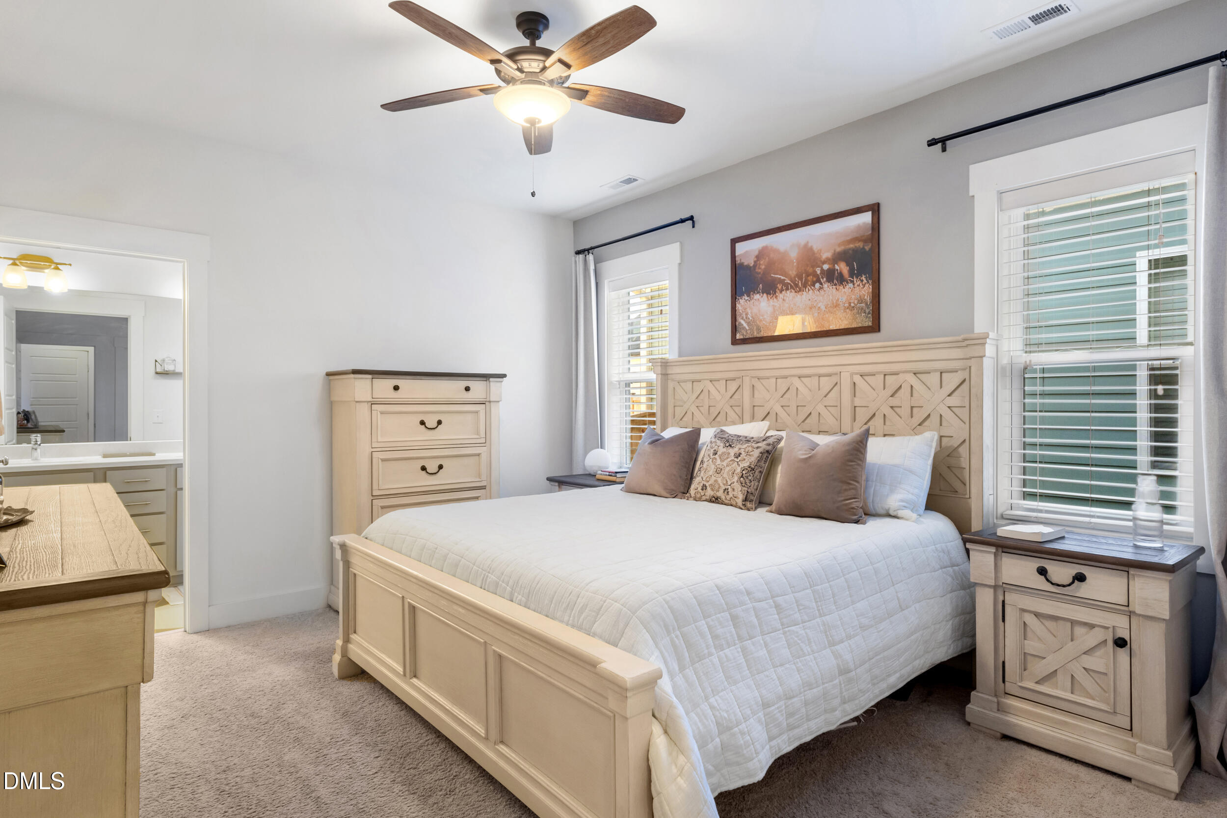 748 Groveview Wendell, NC 27591 - Photo 14 of 38 a bedroom with a bed and a chandelier